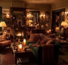 a living room filled with furniture and lit candles