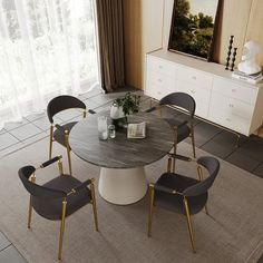 a dining room table with chairs around it