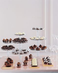 a table topped with lots of different types of desserts