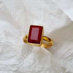 Ruby gold ring, 14K yellow gold ruby ring, cushion raw red ruby gemstone jewelry, welcome gift ring, July birthstone gold wedding gift ring ------------------------------- Size/Dimension (Approx) : All Sizes Available Gemstone : Raw Ruby Stone Shape : Cushion Stone Size (Approx) : 12x8 mm Stone Color : Red ------------------------------- The 14K yellow solid gold bezel and solid yellow gold ring are both shined to an extremely high polish. All rings are packaged and shipped in a beautiful ring box. The main stone is natural, round faceted, ruby. The pictures have been enlarged to show the details. The price is for a 14k gold ring, if you want to order the ring in 18k or 22k gold please convo me prior to purchase. IMPORTANT NOTES This gold jewelry is custom made order jewelry so its possibl Gold Ruby Ring With Rectangular Stone For Anniversary, Rectangular Gold Ruby Ring As Gift, Rectangular Ruby Ring For Wedding, Rectangular Red Ruby Ring For Wedding, Minimalist Gold Ruby Ring, Rectangular Ruby Ring With Gold Setting, Rectangular Ruby Ring For Gift, Gold Rectangular Ruby Ring, Gift Ruby Ring With Rectangular Stone