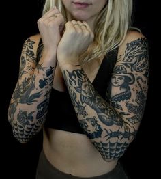 a woman with tattoos on her arms and armbands is posing for the camera