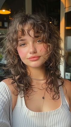 Heartwarming Bangs: 20 Styles for Heart-Shaped Faces Unique Haircuts For Curly Hair, Subtle Bangs Curly Hair, Naturally Curly Hair Bangs, Face Framing Curly Bangs, Bangs In Curly Hair, Fun Curly Haircut, Curly Hair Cuts Bangs, Bangs Heart Shaped Face, Curly Hair Wispy Bangs