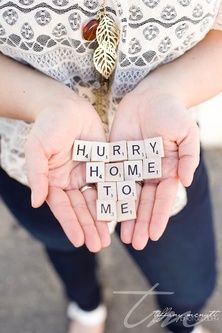 a person holding some type of scrabble with the words hurry home to me