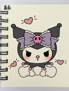 a spiral notebook with an image of a cat wearing a bow