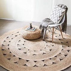 a living room with a chair and rug on the floor