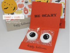 two halloween greeting cards with fake eyes on them