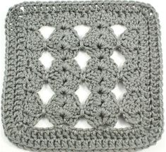 a crocheted square is shown on a white surface