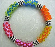 multicolored beaded bracelets on white background