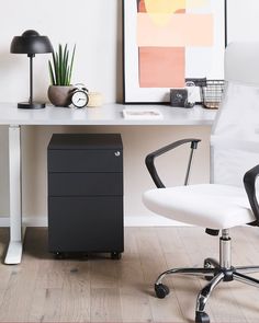 an office chair sitting next to a white desk