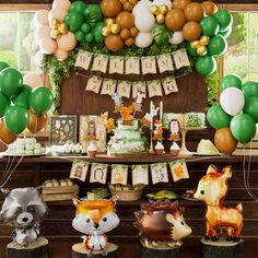 an animal themed birthday party with balloons and decorations