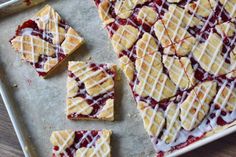 homemade waffles with raspberry sauce and drizzled on top