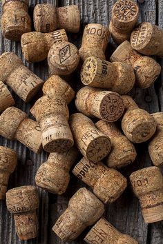 many wine corks are laying on the table