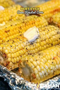 grilled corn on the cob with butter and seasoning sitting on aluminum foil