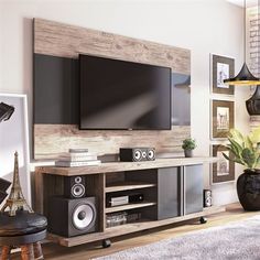 a living room with an entertainment center and large screen tv on the wall above it