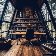 an office with lots of windows and desks in the middle of a wooden floored room