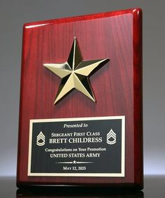 a wooden plaque with a gold star on it and a black plaque that says sergeant first class, breitch children's corporation