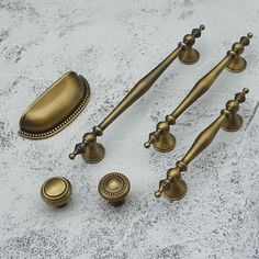 an assortment of antique brass bathroom hardware