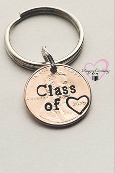 a penny keychain with the word class of 2009 on it and a heart