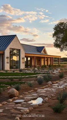 the exterior of a modern home with stone pathway leading to it