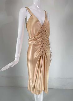 For Sale on 1stDibs - John Galliano, old Hollywood glamourous gold satin evening dress with a plunge V neckline and chiffon woven shirred center front, The back features a row Backless Ruched Satin Dress For Evening, Ruched Backless Satin Dress For Evening, Elegant Gold V-neck Evening Dress, Luxury Silk Satin Party Dress, Gold V-neck Evening Dress For Gala, Glamorous Ruched Satin Party Dress, Glamorous Satin Evening Dress For Dinner, V-neck Evening Dress For Prom Season Dinner, Luxury Satin V-neck Evening Dress