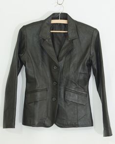 Ladies black leather short jacket , vintage, classic, button closure, 2 flap pockets , size S  materials - genuine leather  lining 100% polyester excellent condition. pre owned. Please see photos for more detail  and feel Free to ask any Question The actual measurements (laying flat ) bust (armpit to armpit ) 42 cm - 16,5 in waist                                  34 cm - 13.5 in shoulder to sleeve           57 cm- 22.5 in shoulder to shoulder       39 cm - 15.5 in collar to hem                       57 cm - 22.5 in  weight  0.50 kg - 1.1 Lbs. Short Cuir, Black Leather Shorts, Leather Short, Leather Shorts, Jacket Vintage, Black Leather Jacket, Short Jacket, Flap Pocket, Ukraine