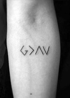 a woman's arm with the word vav tattooed on her left calf sleeve