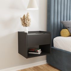 a bed room with a neatly made bed and a book shelf on the wall next to it