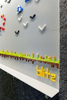 a lego wall with the words build spelled on it