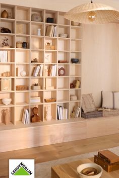 a living room filled with furniture and bookshelves