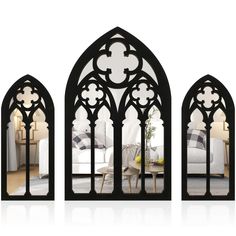 three black arched mirrors with white furniture in the middle and one on the other side