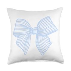 a white pillow with a light blue bow on the front and back of it,