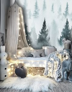 a bedroom decorated in white and grey with lights on the bed, teddy bear rugs