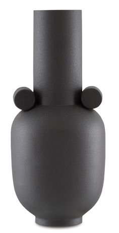 a black vase sitting on top of a white table