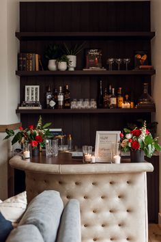 the bar is decorated with flowers and candles