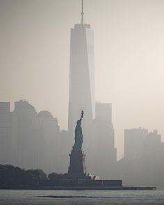 the statue of liberty is surrounded by fog