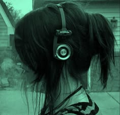 a person with headphones on their ears