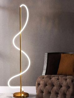 a floor lamp that is next to a couch