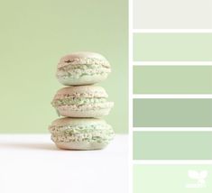 three macaroons stacked on top of each other in front of a green background