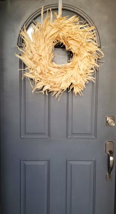 a door with a wreath hanging on it