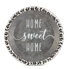 a black and white plate with the words home sweet home written in cursive writing