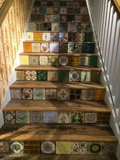 the stairs are decorated with colorful tiles