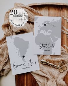 two cards with the names and map of south africa on them next to a pair of scissors