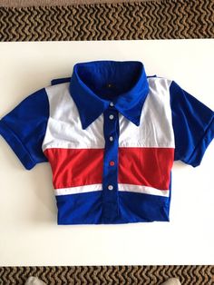 Vintage retro button up collar tshirt. Blue red and white. Fitted size s. Condition is perfect. Cheap Retro Shirt With Pockets, Casual Red Polo Shirt With Collared Neckline, Vintage Blue Collared T-shirt, Blue Sporty Top With Collared Neckline, Sporty Blue Tops With Collared Neckline, Sporty Blue Top With Collared Neckline, Retro Polo Collar T-shirt For Summer, Retro Blue Polo Collar T-shirt, Retro Cotton Polo Shirt For Summer