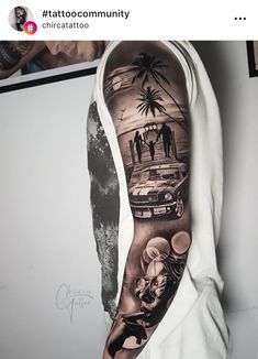 a man's arm with an image of people on the beach and cars in the background