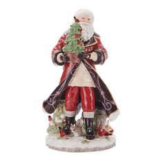 a santa clause figurine holding a christmas tree