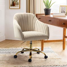 an office chair sitting on top of a rug in front of a desk with a potted plant