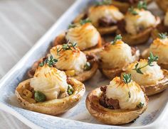 small appetizers are arranged on a blue and white platter, ready to be eaten