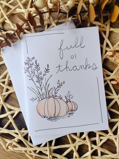 two cards with pumpkins and flowers on them