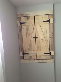 a wooden door is hanging on the wall