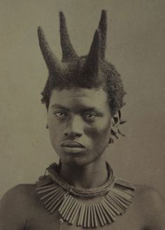 an old photo of a man with horns on his head